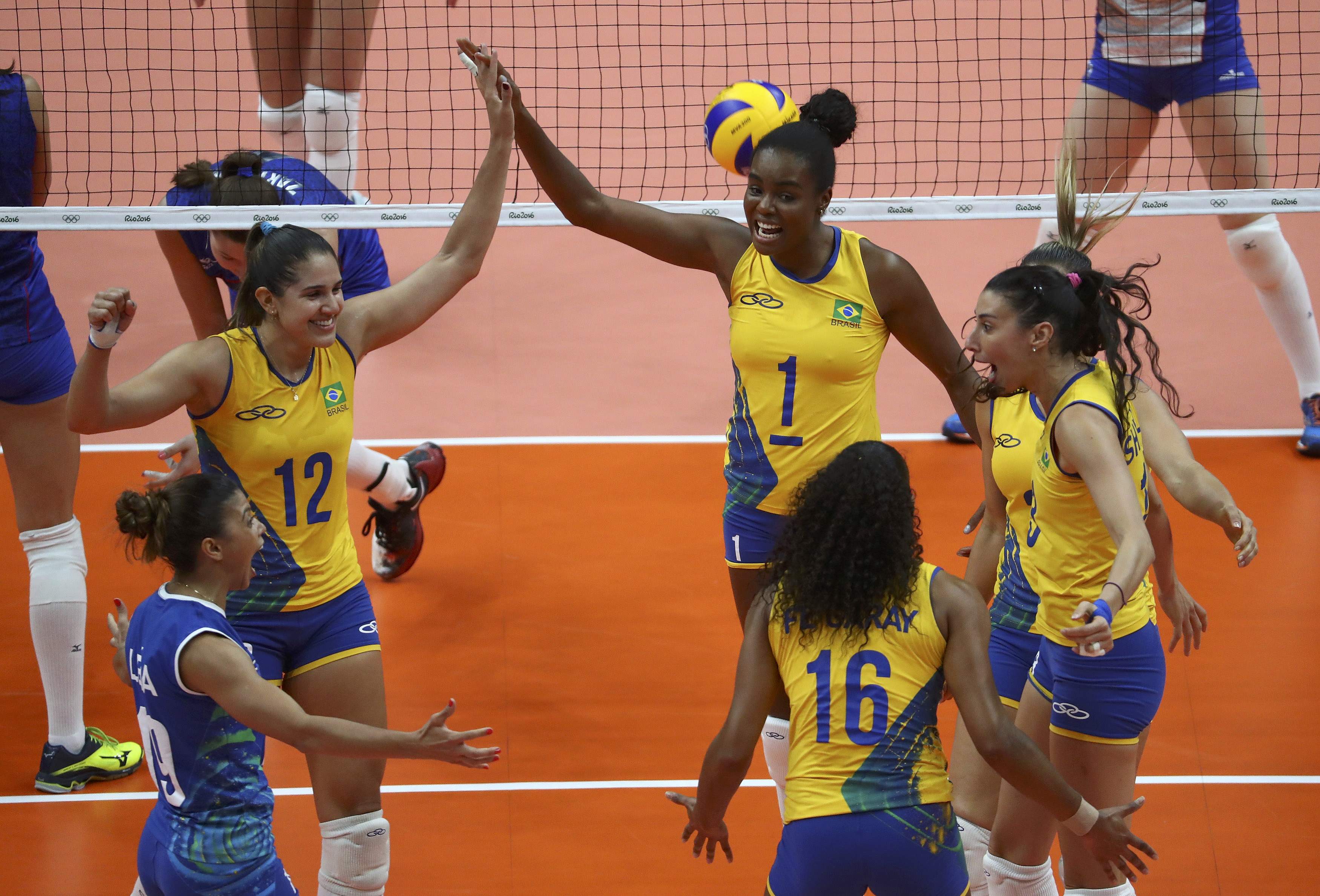 2016 Rio Olympics - Women's Preliminary - Pool A Brazil v Russia - Maracanazinho - Rio de Janeiro, Brazil - 14/08/2016. Natalia (BRA) of Brazil (2L) celebrates a point wiht Fabiana (BRA) of Brazil (C) <script type=